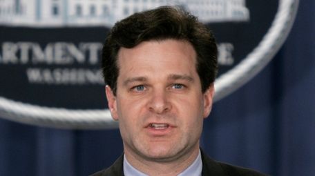 Then-Assistant Attorney General Christopher Wray speaks at a