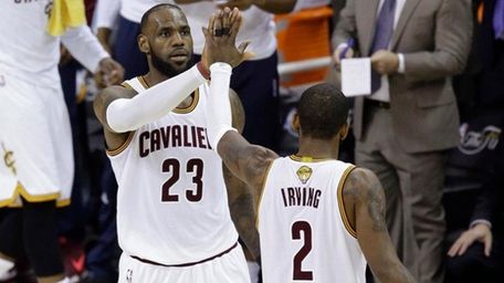 Cleveland Cavaliers forward LeBron James and teammate Kyrie