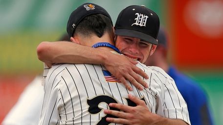 Pitcher Brendan Has (25) of Wantagh is hugged