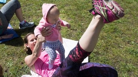 Krista Cardillo and her 7-month-old daughter, Charlie, move