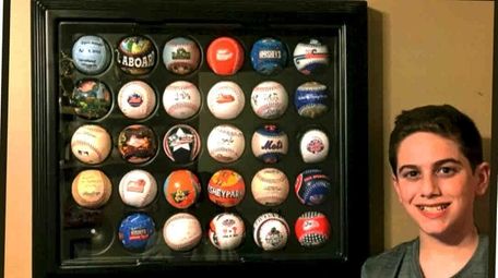 Ryan Maggio of Wantagh with his baseball collection