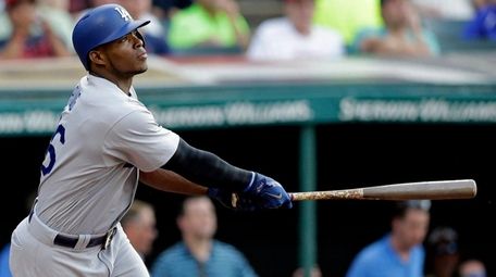 Los Angeles Dodgers' Yasiel Puig watches his two-run
