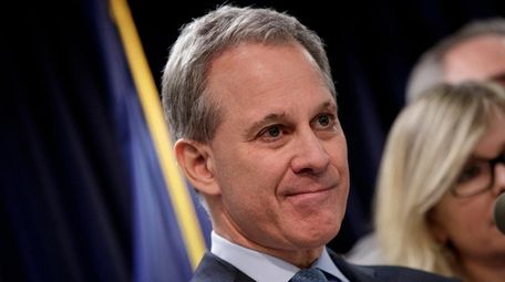 Eric T. Schneiderman at a news conference March