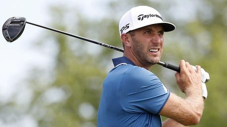 Dustin Johnson of the US hits his tee