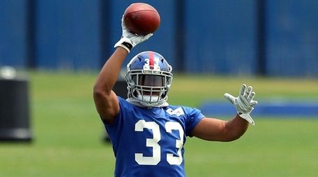 New York Giants safety Andrew Adams (33) catches
