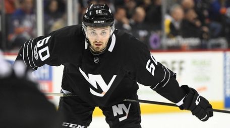 New York Islanders defenseman Adam Pelech looks on