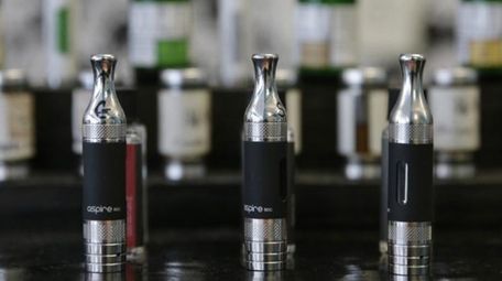Electronic cigarettes and accessories displayed at a store