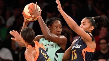 Tina Charles of the Liberty is closely defended