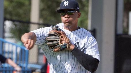 Yankees' Gleyber Torres throws to first against the
