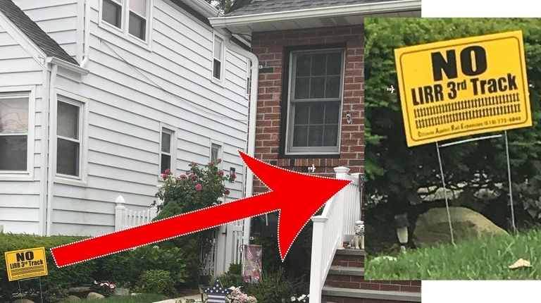 A lawn sign reads