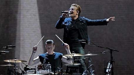 U2's Larry Mullen Jr. and Bono perform during