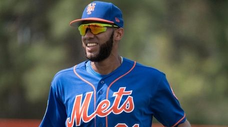The  Mets' Amed Rosario looks on during a