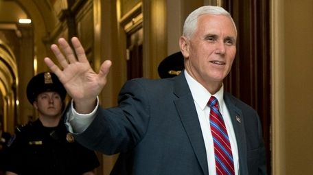 Vice President Mike Pence waves as he walks