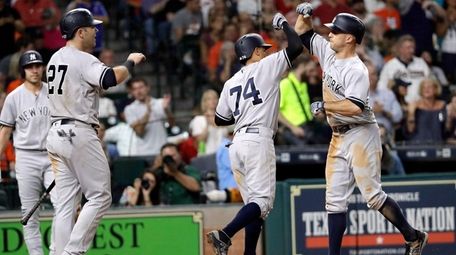 The Yankees' Brett Gardner, right, celebrates with Ronald