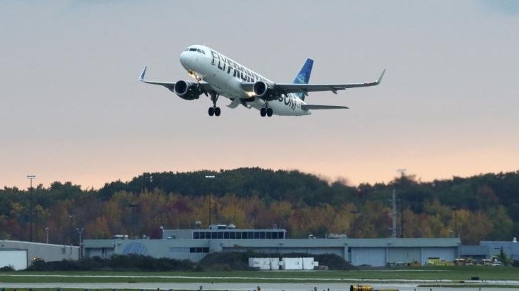 A Frontier Airlines plane departs Cleveland Hopkins International