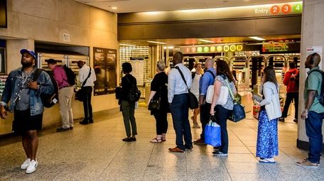 LIRR commuters wait on line to buy Metrocards