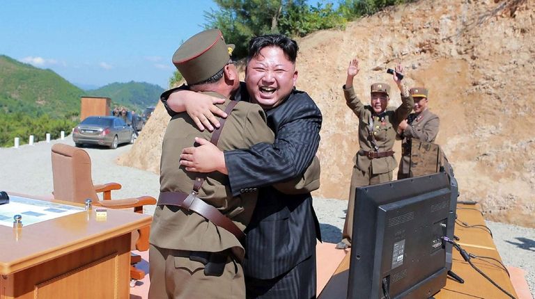 North Korean leader Kim Jong Un celebrates the