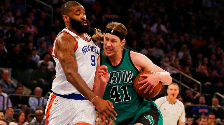 Kelly Olynyk of the Boston Celtics drives to the