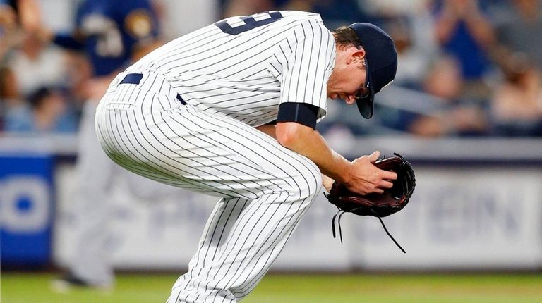 Tyler Clippard of the Yankees reacts after surrendering