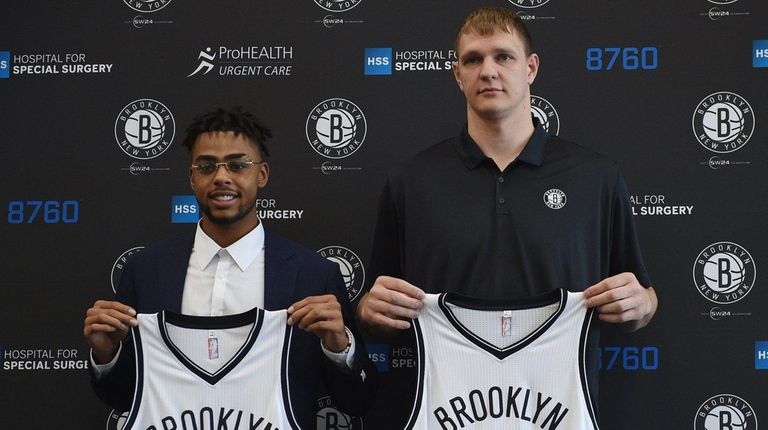 The Nets newest players D'Angelo Russell, left, and