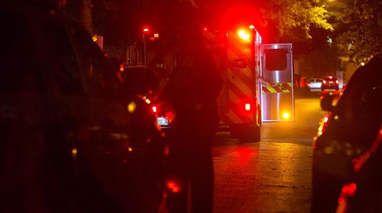 An ambulance leaves the scene.