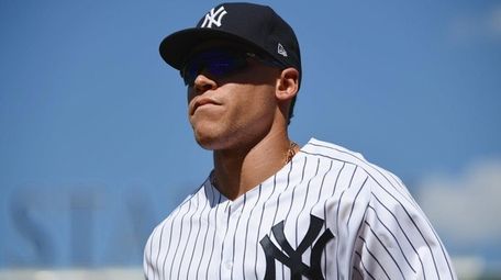Yankees rightfielder Aaron Judge returns to the dugout at