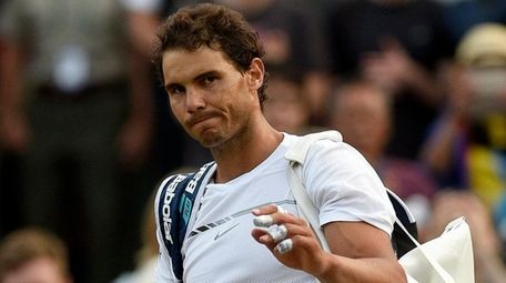 Rafael Nadal of Spain reacts after losing against