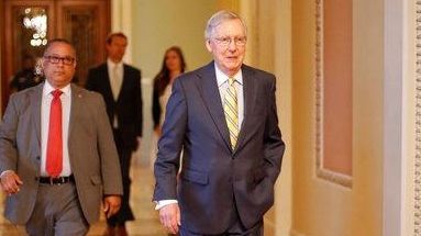 Senate Majority Leader Mitch McConnell of Ky. walks