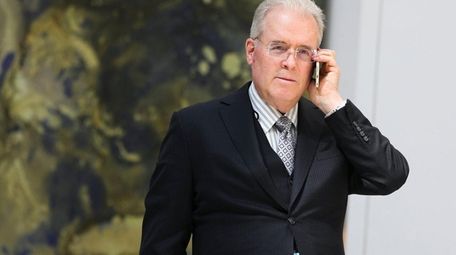 Billionaire Robert Mercer speaks on the phone during