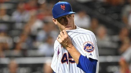 New York Mets starting pitcher Zack Wheeler walks