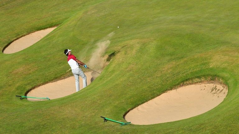 Bubba Watson of the United States hits a