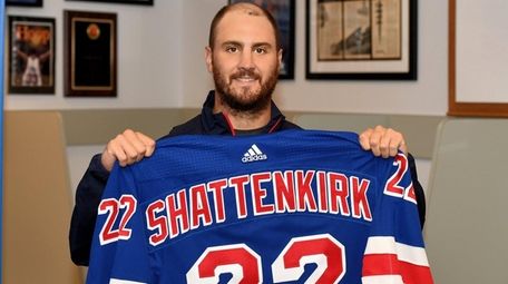 Kevin Shattenkirk of the Rangers poses with his jersey during a