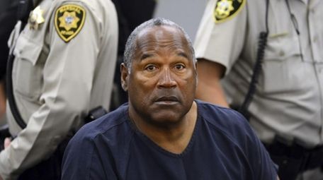 O.J. Simpson sits during a break on the
