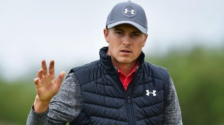 Jordan Spieth waves on the 16th hole during