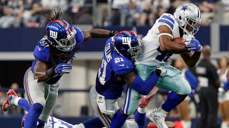 Dallas Cowboys linebacker James Morris is brought down