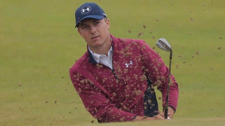 Jordan Spieth plays out of the bunker on