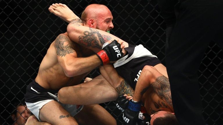 Bantamweights Brian Kelleher and Marlon Vera fight during