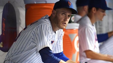 Mets pitcher Zack Wheeler looks on from the