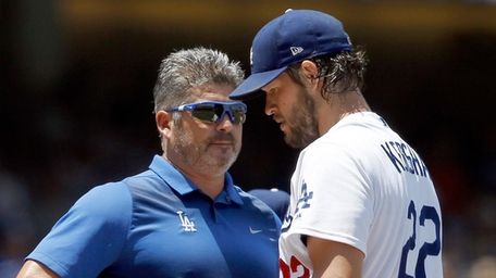 Los Angeles Dodgers starting pitcher Clayton Kershaw, right,