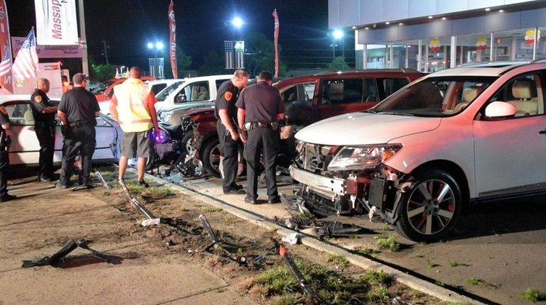 A car crashed into an auto dealership parking