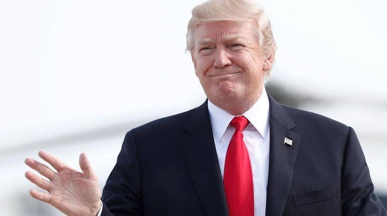 President Donald Trump boards Air Force One, July