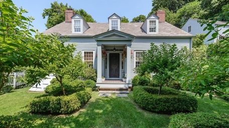 The three-bedroom, 2½-bath restored Colonial is set on