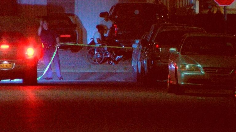 Police at the scene where four people were