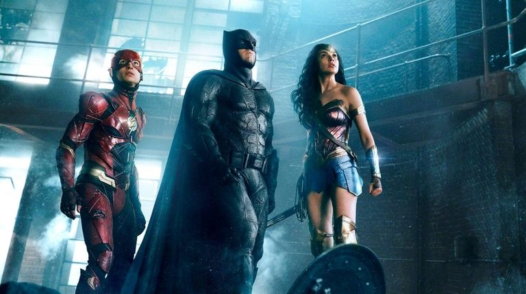 Ezra Miller, left, as the Flash, Ben Affleck