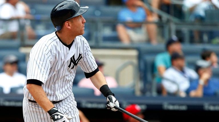 Todd Frazier of the Yankees follows through on