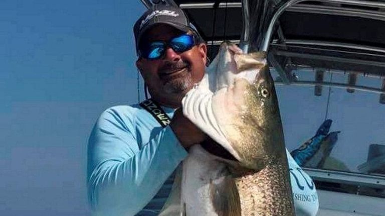 Ruggiero Leonard hefts the 64.8-pound cow he decked