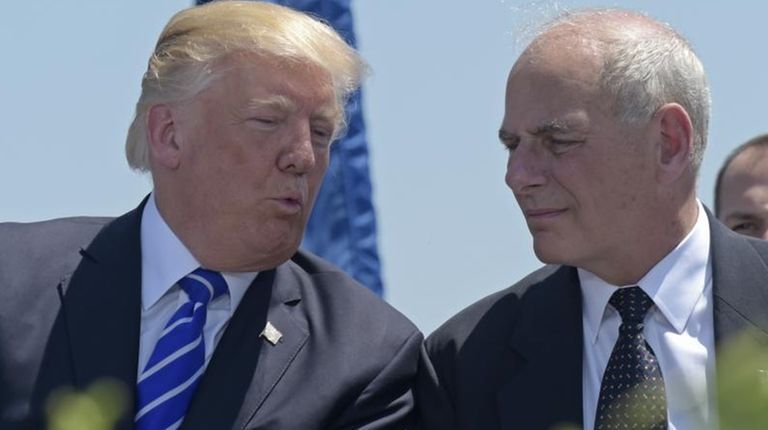President Donald Trump talks with Homeland Security Secretary