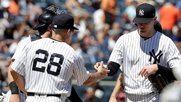 Yankees manager Joe Girardi takes the ball from