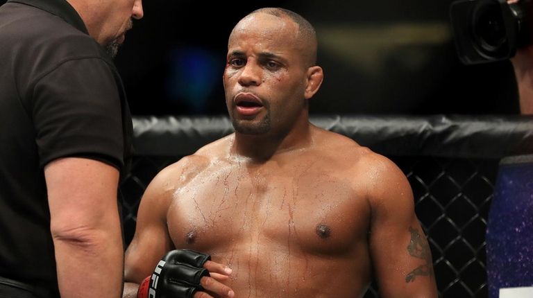Daniel Cormier is checked by referee John McCarthy