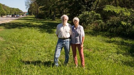 Siblings Gina and Larry Foglia near one of